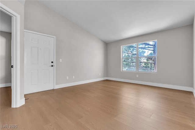1150 N Buffalo Dr Unit 2025, Las Vegas, NV 89128 - unfurnished room with light wood finished floors and vaulted ceiling