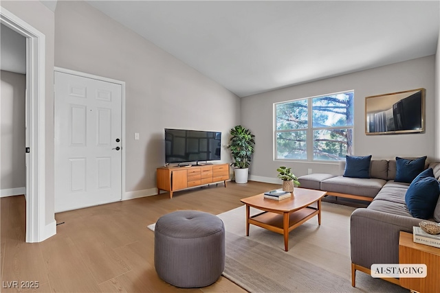 1150 N Buffalo Dr Unit 2025, Las Vegas, NV 89128 - living area with vaulted ceiling and wood finished floors