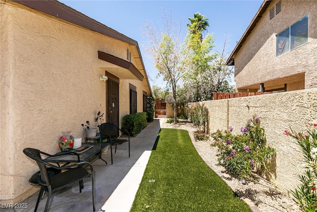 3890 Lancome St, Las Vegas, NV 89115 - view of yard featuring a patio