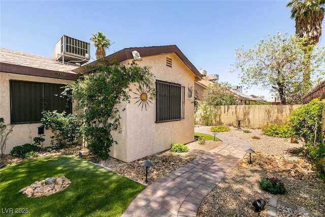 3890 Lancome St, Las Vegas, NV 89115 - view of property exterior with stucco siding and cooling unit