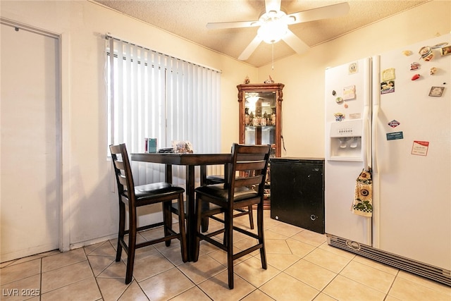 3890 Lancome St, Las Vegas, NV 89115 - dining room featuring a textured ceiling, ceiling fan, and light tile patterned flooring