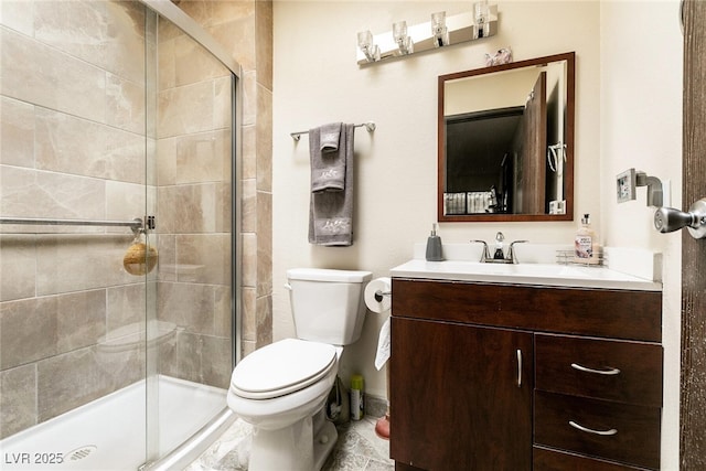 3890 Lancome St, Las Vegas, NV 89115 - bathroom with vanity, toilet, and a shower stall