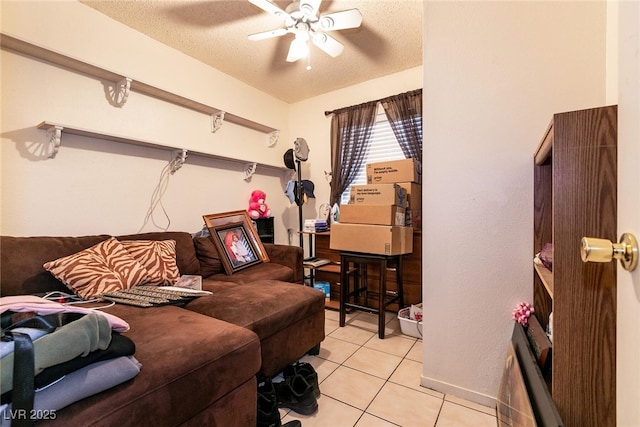 3890 Lancome St, Las Vegas, NV 89115 - bedroom with light tile patterned floors, a textured ceiling, and a ceiling fan