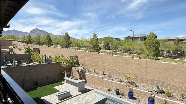 754 Agate Hills St, Las Vegas, NV 89138 - fenced backyard featuring a patio area and a mountain view