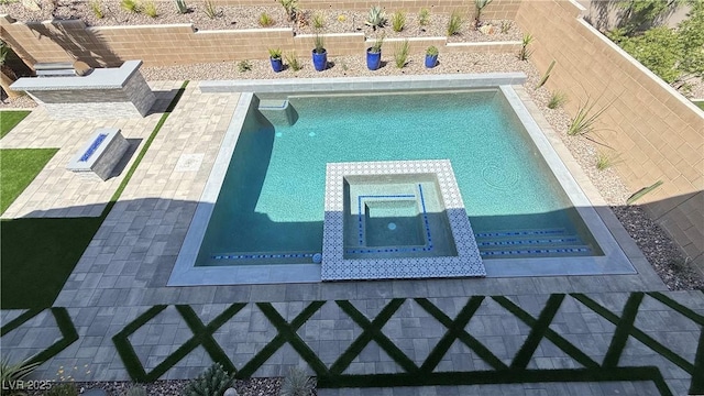 754 Agate Hills St, Las Vegas, NV 89138 - view of swimming pool featuring a pool with connected hot tub and a fenced backyard