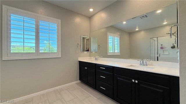 754 Agate Hills St, Las Vegas, NV 89138 - bathroom with healthy amount of natural light, double vanity, a shower stall, and baseboards