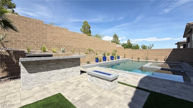 754 Agate Hills St, Las Vegas, NV 89138 - view of swimming pool featuring a fire pit, a fenced backyard, a patio area, and an in-ground hot tub