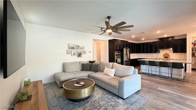 754 Agate Hills St, Las Vegas, NV 89138 - living room featuring a ceiling fan, light wood finished floors, recessed lighting, and baseboards