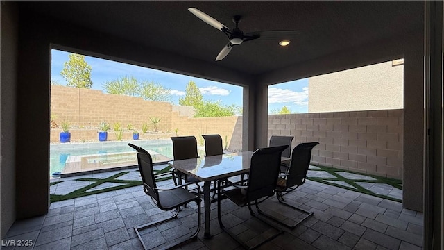 754 Agate Hills St, Las Vegas, NV 89138 - fenced backyard featuring a ceiling fan, a patio area, and outdoor dining space