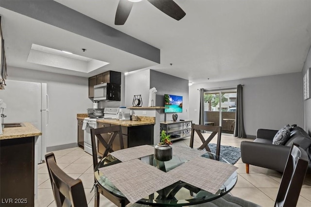 4200 S Valley View Blvd Unit 1007, Las Vegas, NV 89103 - dining room with light tile patterned floors, ceiling fan, baseboards, and a raised ceiling