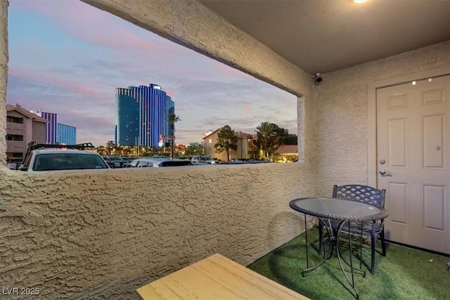 4200 S Valley View Blvd Unit 1007, Las Vegas, NV 89103 - balcony at dusk with a city view