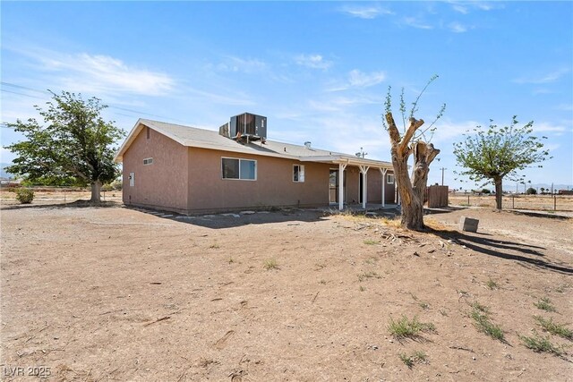 2440 Homestead Rd, Pahrump, NV 89048 - rear view of property with central AC unit