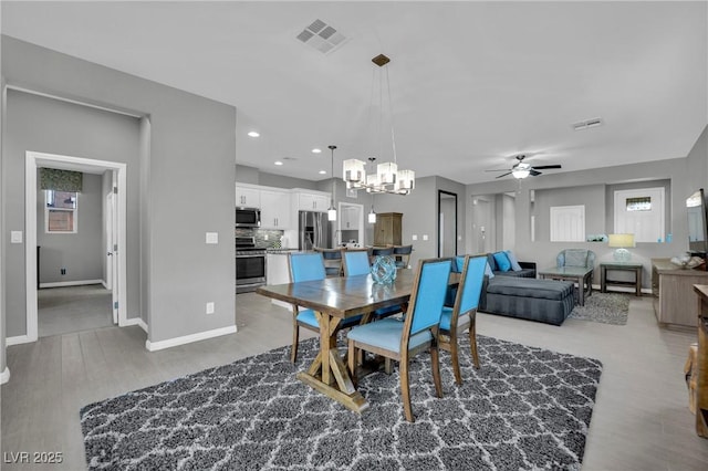 708 Kibbey St, Las Vegas, NV 89178 - dining space with ceiling fan, light wood-style floors, baseboards, a chandelier, and recessed lighting