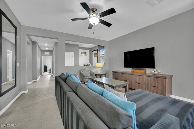 708 Kibbey St, Las Vegas, NV 89178 - living area featuring baseboards, light wood finished floors, a ceiling fan, and recessed lighting