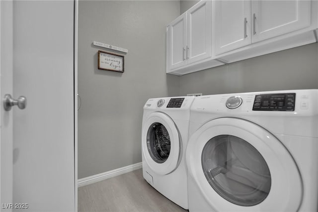 708 Kibbey St, Las Vegas, NV 89178 - laundry room featuring cabinet space, washer and dryer, baseboards, and light wood-style flooring