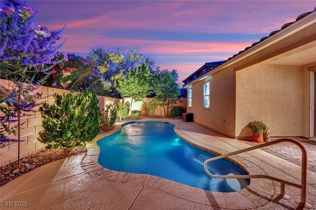708 Kibbey St, Las Vegas, NV 89178 - pool at dusk with a fenced backyard and a patio