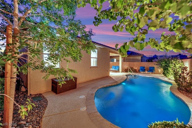 708 Kibbey St, Las Vegas, NV 89178 - pool at dusk featuring a patio and a fenced backyard