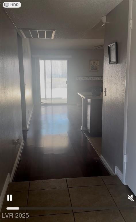 5389 Spencer St, Las Vegas, NV 89119 - hall with baseboards and tile patterned flooring