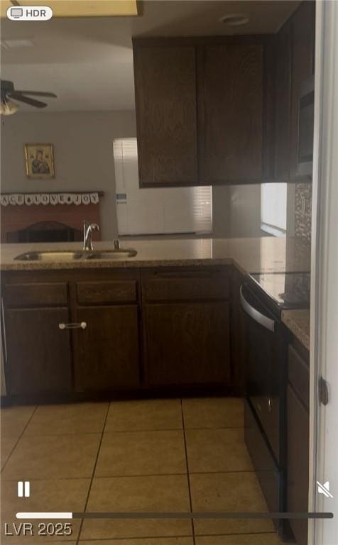 5389 Spencer St, Las Vegas, NV 89119 - kitchen featuring electric range oven, a sink, a ceiling fan, light tile patterned floors, and dark brown cabinets