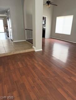 5389 Spencer St, Las Vegas, NV 89119 - empty room with wood finished floors, baseboards, a ceiling fan, and arched walkways