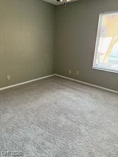 5389 Spencer St, Las Vegas, NV 89119 - carpeted empty room with baseboards and a ceiling fan