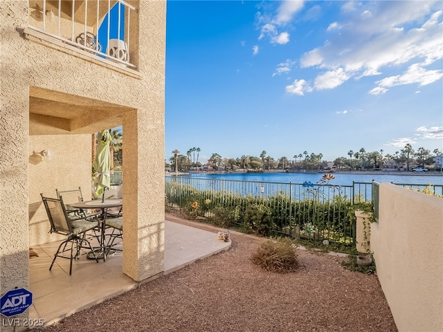 2521 Seascape Dr, Las Vegas, NV 89128 - view of patio featuring a water view and outdoor dining space