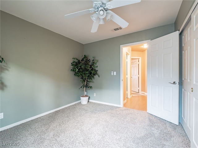 2521 Seascape Dr, Las Vegas, NV 89128 - unfurnished bedroom with carpet flooring, baseboards, and a ceiling fan
