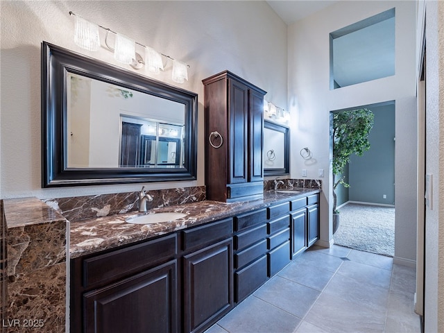 2521 Seascape Dr, Las Vegas, NV 89128 - bathroom with double vanity, tile patterned flooring, and a towering ceiling