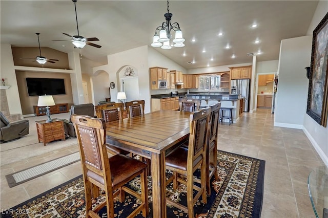 1361 Moose St, Pahrump, NV 89048 - dining area featuring arched walkways, a ceiling fan, a chandelier, light tile patterned floors, and recessed lighting