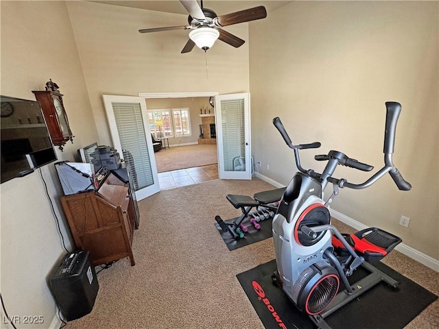 1361 Moose St, Pahrump, NV 89048 - exercise area featuring baseboards, carpet floors, ceiling fan, a towering ceiling, and french doors