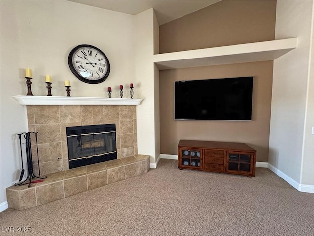 1361 Moose St, Pahrump, NV 89048 - living room featuring baseboards, carpet, a tiled fireplace, and lofted ceiling