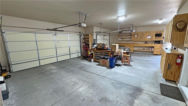 1361 Moose St, Pahrump, NV 89048 - garage with a garage door opener and a workshop area