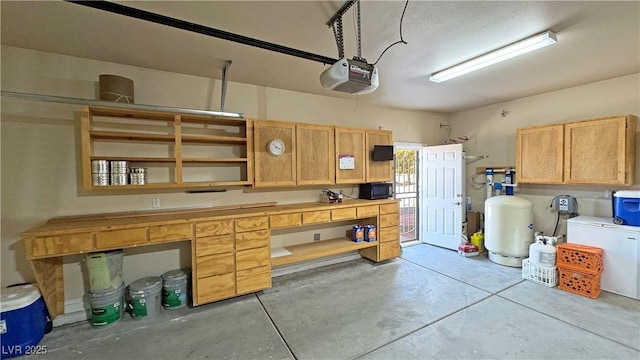 1361 Moose St, Pahrump, NV 89048 - garage with a garage door opener and a workshop area