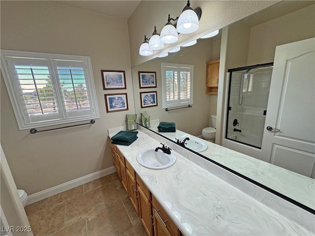 1361 Moose St, Pahrump, NV 89048 - full bath featuring toilet, baseboards, vanity, and shower / bath combination with glass door