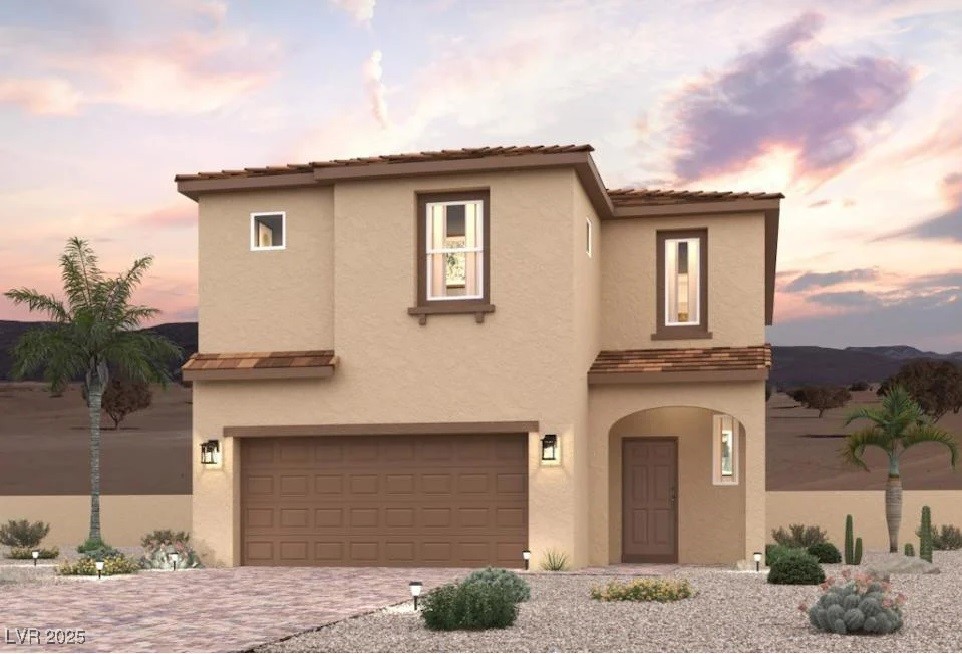 9975 Ruby Dome Ave, Las Vegas, NV 89178 - view of front of property featuring stucco siding, an attached garage, and driveway