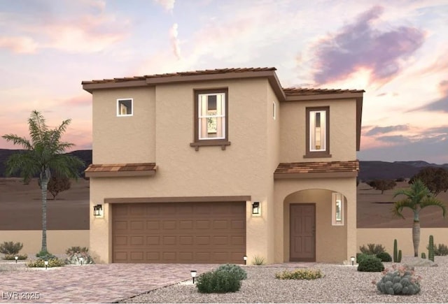 9975 Ruby Dome Ave, Las Vegas, NV 89178 - view of front of property featuring stucco siding, an attached garage, and driveway
