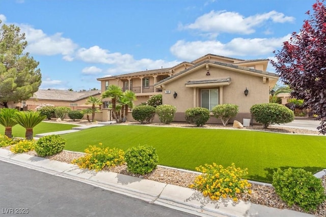7001 Via Locanda Ave, Las Vegas, NV 89131 - mediterranean / spanish-style house with stucco siding and a front yard