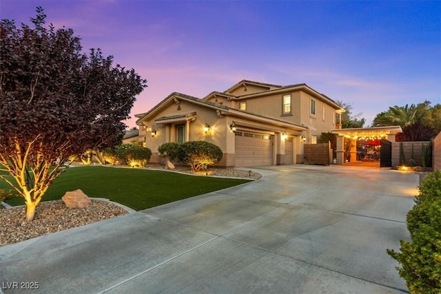 7001 Via Locanda Ave, Las Vegas, NV 89131 - view of front facade featuring concrete driveway, a gate, and stucco siding