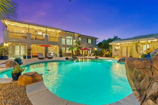 7001 Via Locanda Ave, Las Vegas, NV 89131 - pool at dusk with an outdoor pool and a patio