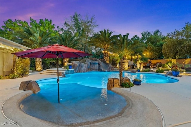 7001 Via Locanda Ave, Las Vegas, NV 89131 - pool at dusk featuring a patio area