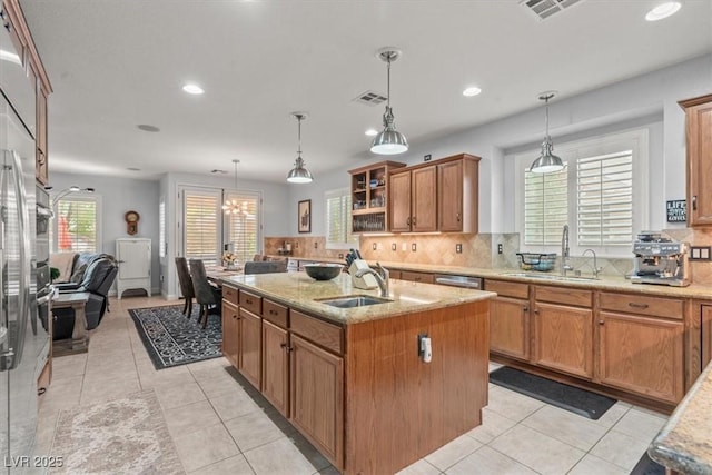 7001 Via Locanda Ave, Las Vegas, NV 89131 - kitchen featuring a sink, an island with sink, backsplash, recessed lighting, and pendant lighting