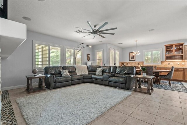 7001 Via Locanda Ave, Las Vegas, NV 89131 - living room featuring a chandelier, light tile patterned floors, and ceiling fan