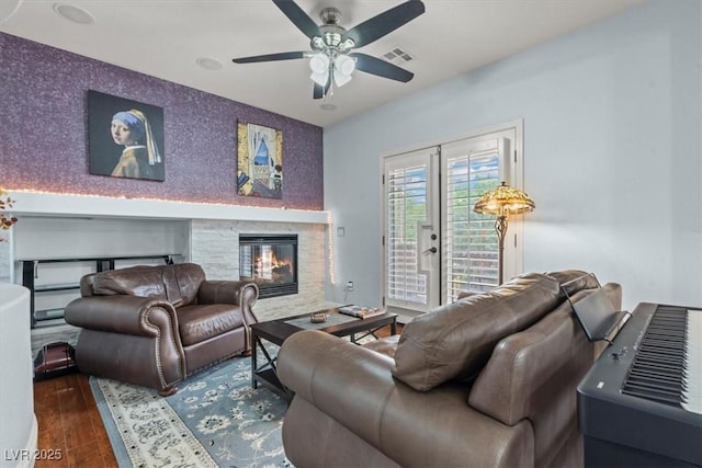 7001 Via Locanda Ave, Las Vegas, NV 89131 - living room featuring wood finished floors, ceiling fan, and a fireplace