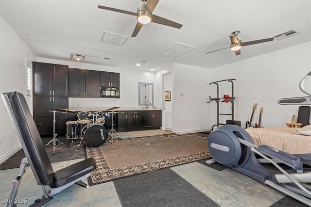 7001 Via Locanda Ave, Las Vegas, NV 89131 - workout area with ceiling fan, attic access, and a sink