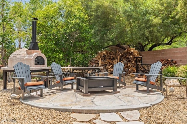 7001 Via Locanda Ave, Las Vegas, NV 89131 - view of patio / terrace featuring a fire pit