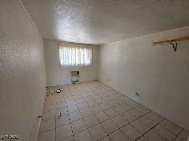 5440 Swenson St Unit 18, Las Vegas, NV 89119 - unfurnished room featuring a textured ceiling, light tile patterned floors, a textured wall, and heating unit