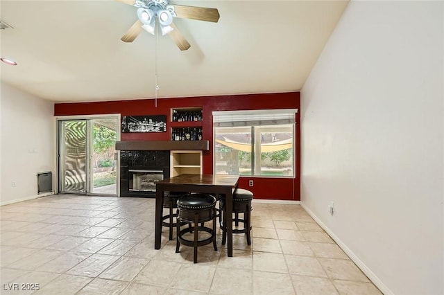 1905 Dakota Hills Ave, Las Vegas, NV 89123 - dining space featuring a premium fireplace, ceiling fan, and built in features
