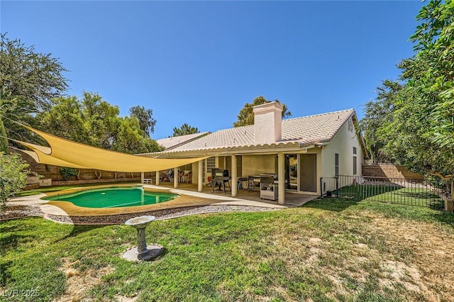 1905 Dakota Hills Ave, Las Vegas, NV 89123 - back of property with a chimney, a patio area, stucco siding, and a tiled roof
