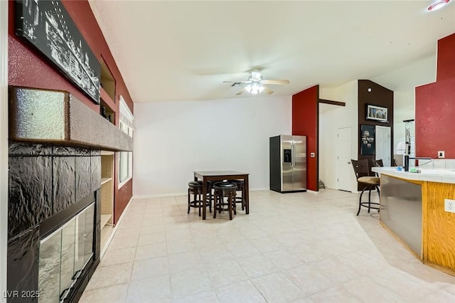 1905 Dakota Hills Ave, Las Vegas, NV 89123 - dining room with vaulted ceiling, a ceiling fan, and light floors