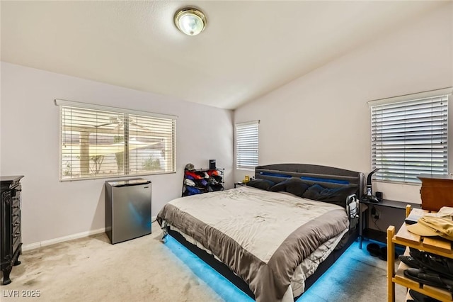 1905 Dakota Hills Ave, Las Vegas, NV 89123 - bedroom with stainless steel fridge, vaulted ceiling, and light colored carpet